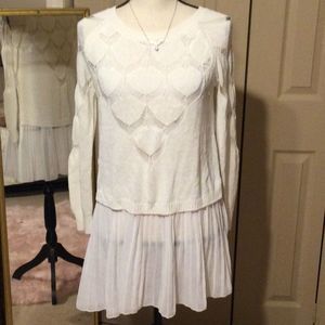 Simply couture designer ivory with a white ruffled bottom. Size Medium